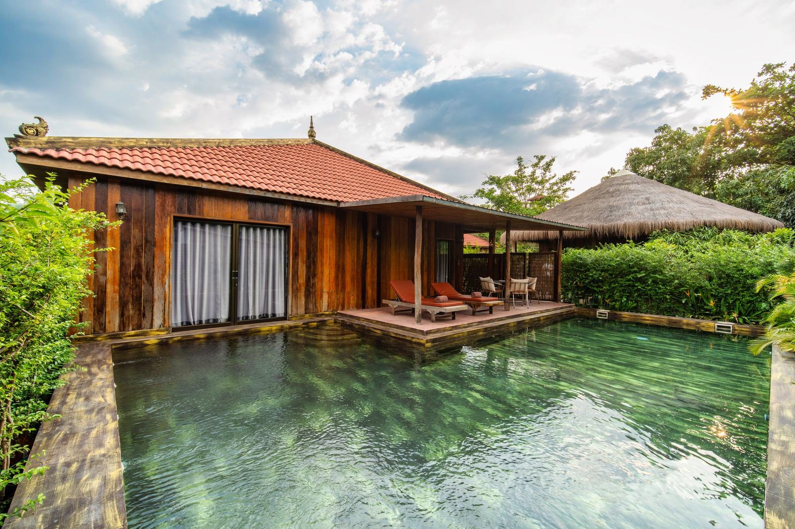 A wooden pool villa and its private pool