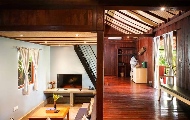 Family bungalow living room with a ladder to the loft