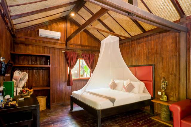 Terrace bungalow bedroom in dark wood