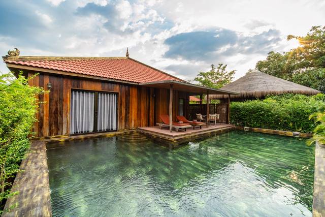 A wooden pool villa and its private pool