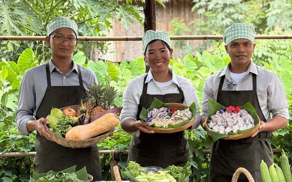 Khmer cooks preparing a cooking class in a garden